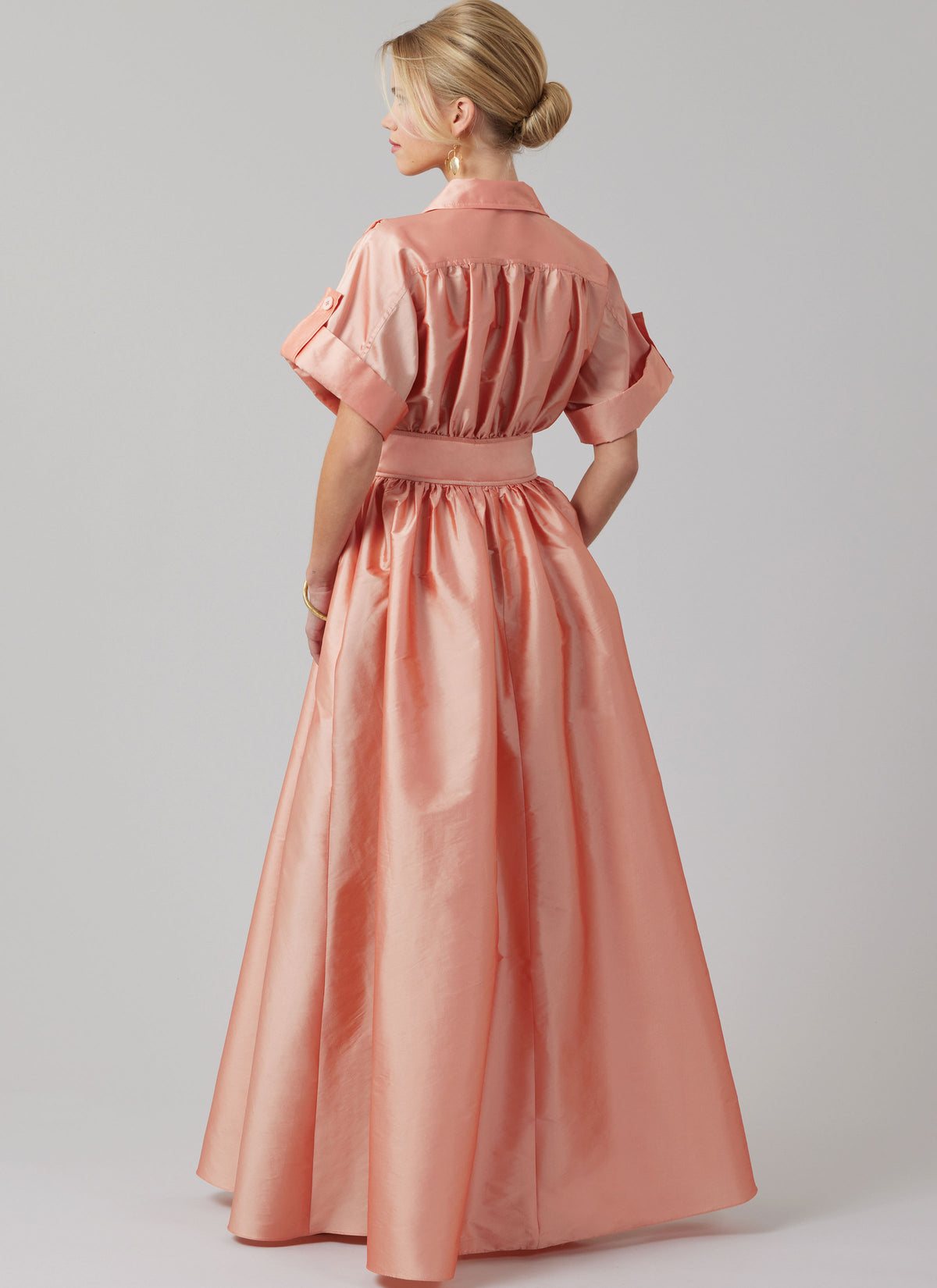 McCall's M8556 pattern envelope showing a button front dress with full skirt