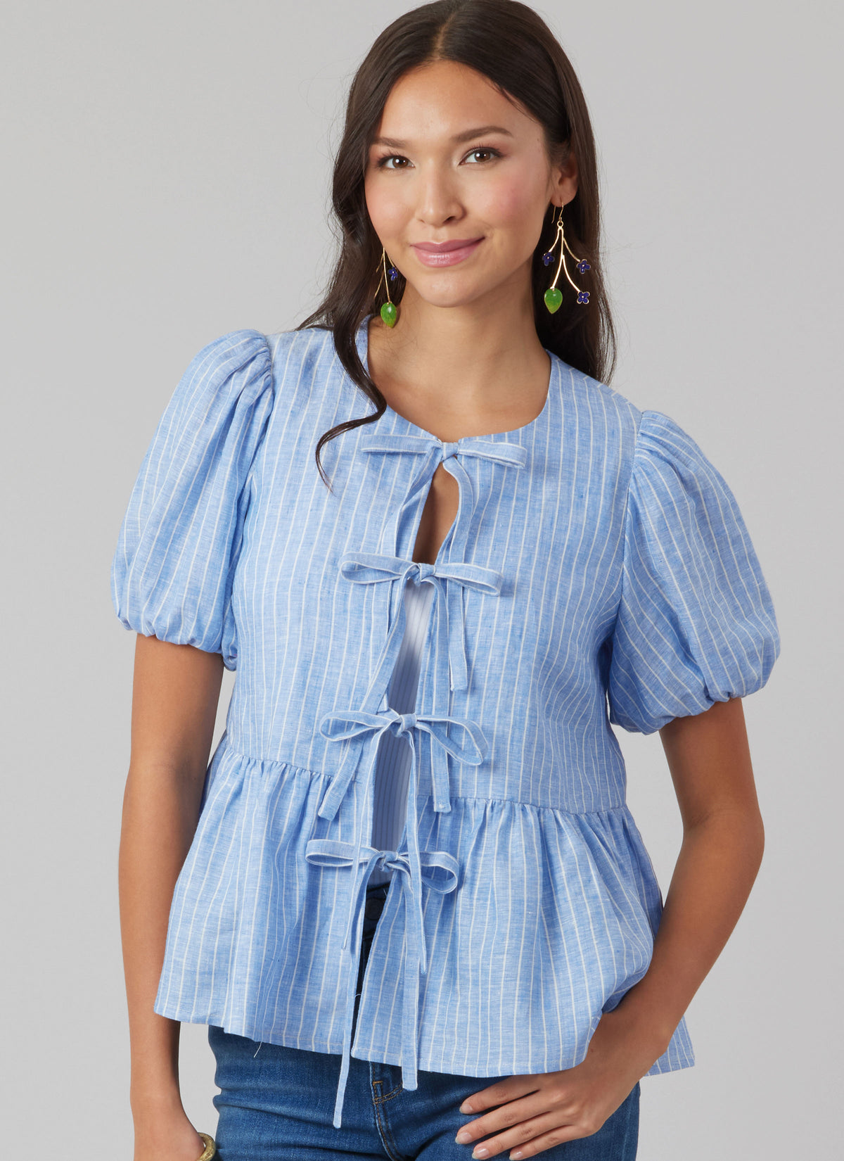 McCall's M8557 pattern envelope showing tie front tops in four styles