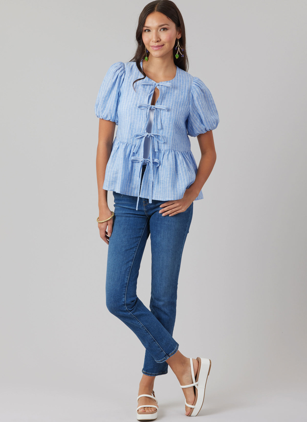 McCall's M8557 pattern envelope showing tie front tops in four styles