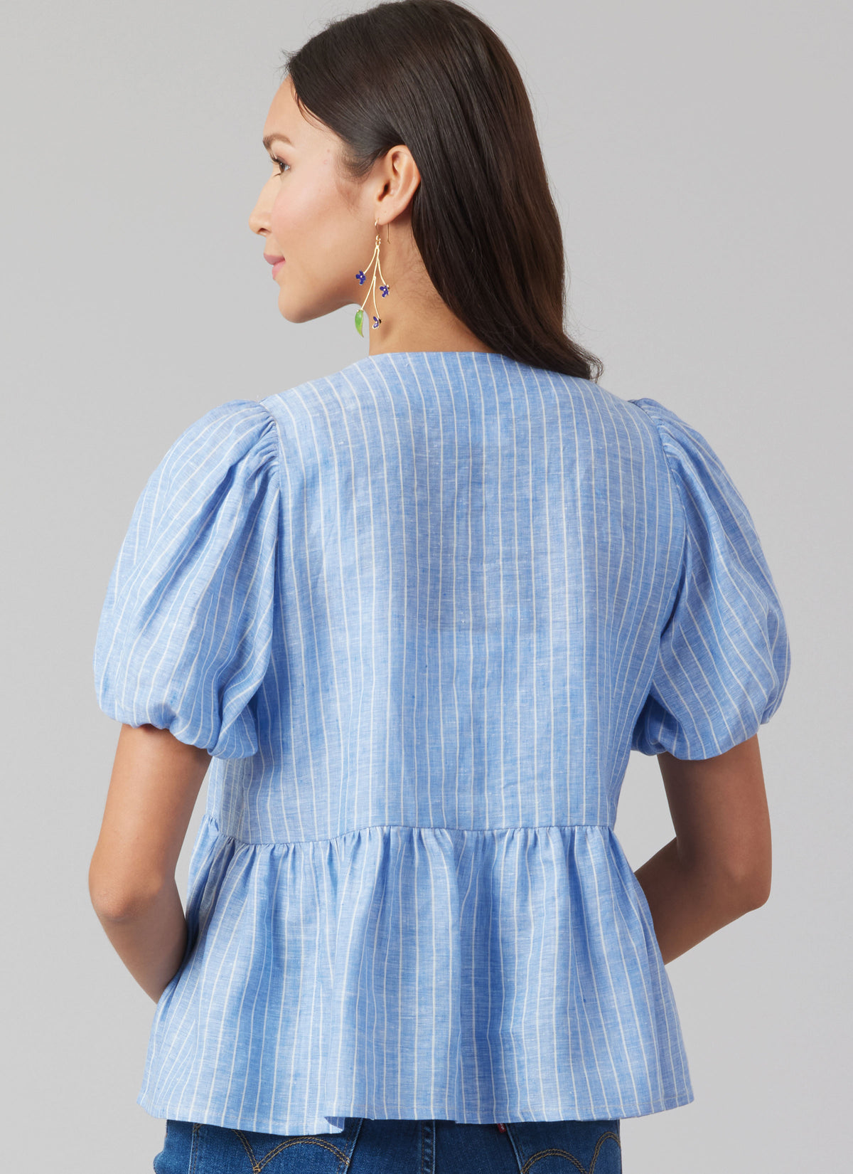 McCall's M8557 pattern envelope showing tie front tops in four styles