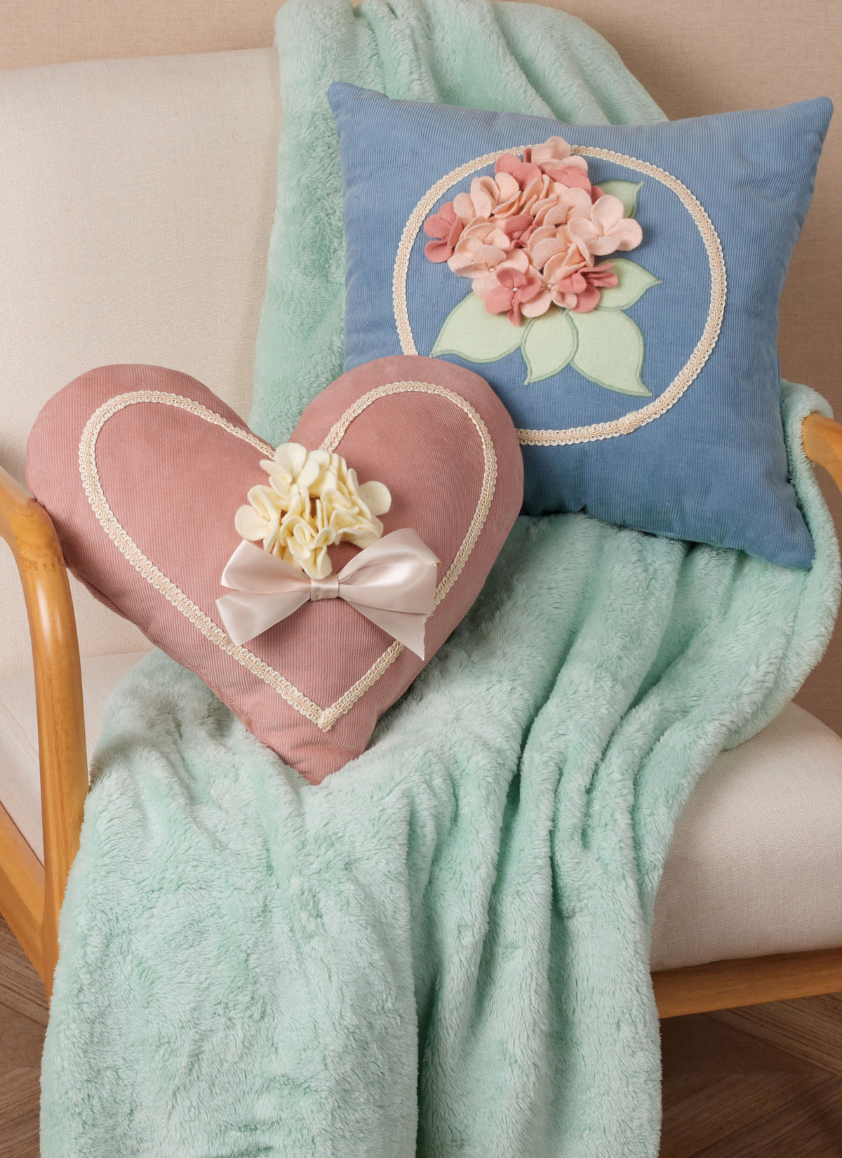 McCall's M8573 sewing pattern envelope showing heart and square cushions designs