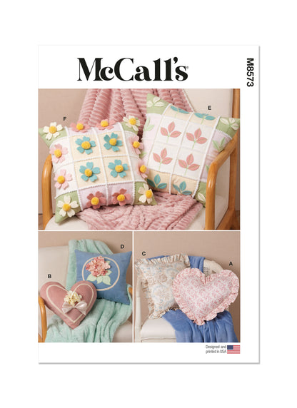 McCall's M8573 sewing pattern envelope showing heart and square cushions designs