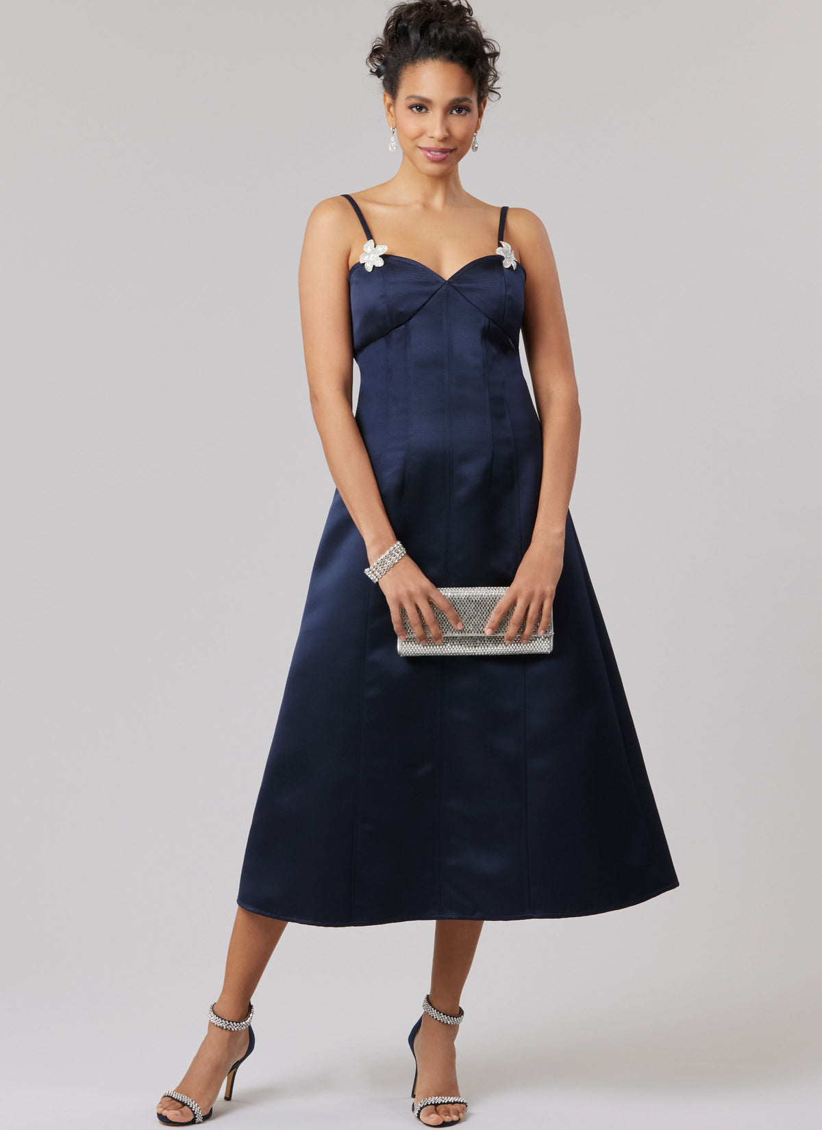 McCall's M8577 sewing pattern envelope showing fitted dress designs