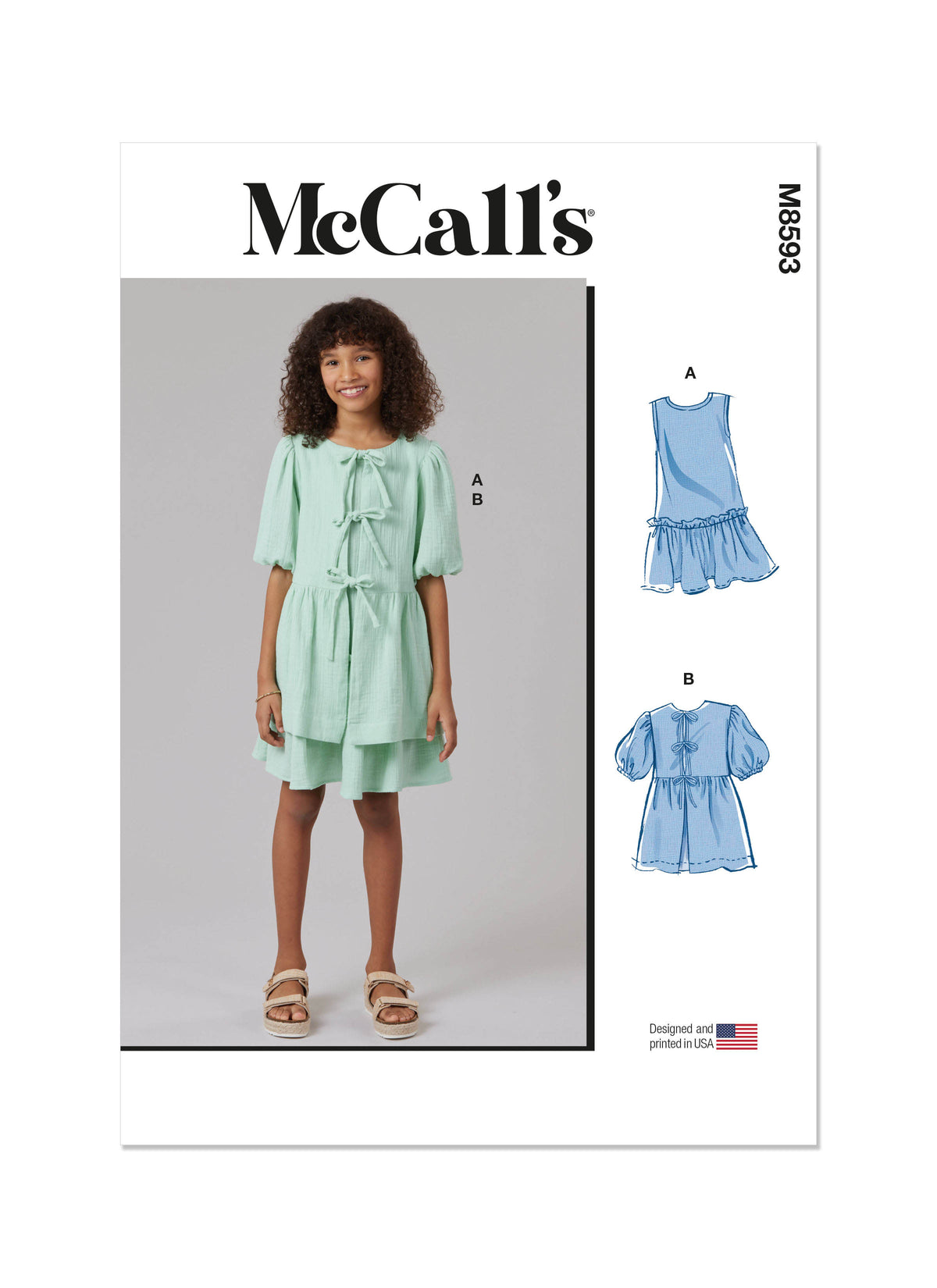 McCall's M8593 sewing pattern envelope showing girls' dress and top designs