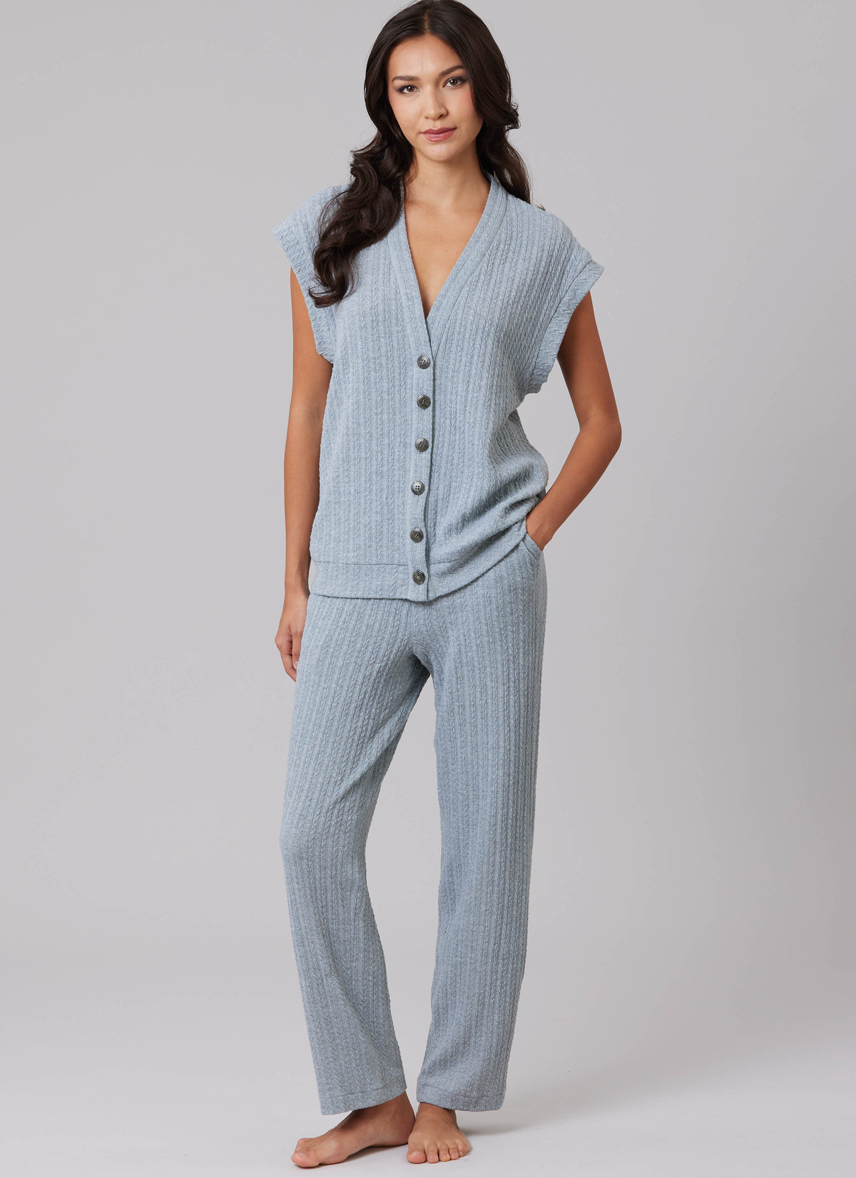McCall's M8637 sewing pattern envelope showing a V-neck waistcoat and cardigan