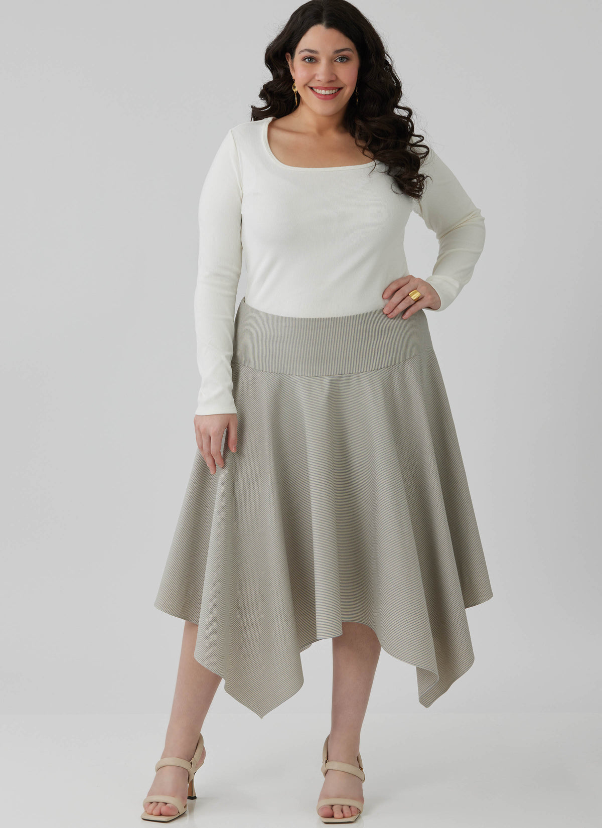 McCall's M8659 sewing pattern envelope showing handkerchief hem skirt designs