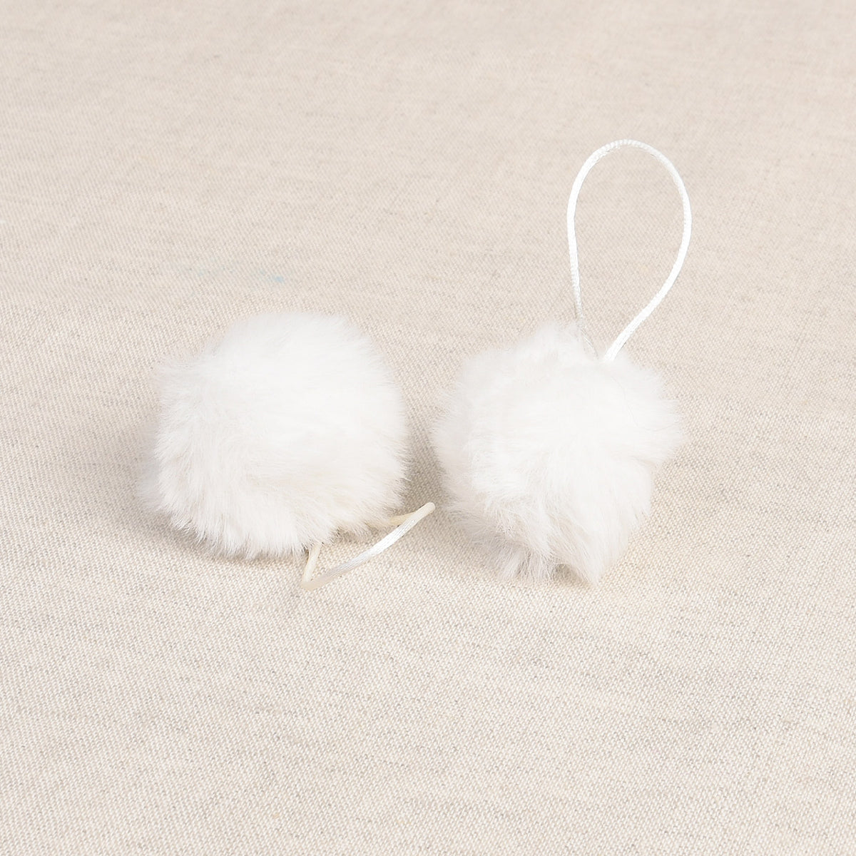 White faux fur pom pom with loop