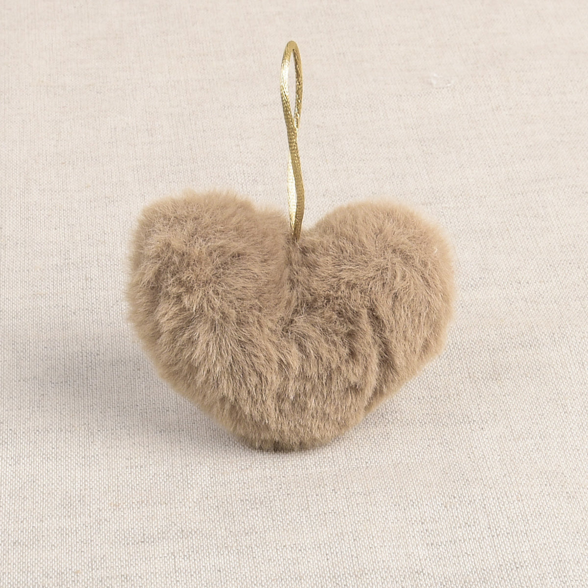 Khaki faux fur heart-shaped pom pom with a hanging loop