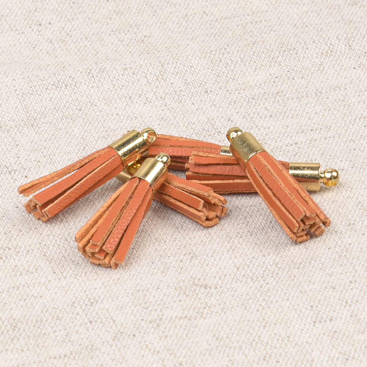 Small orange mini tassel