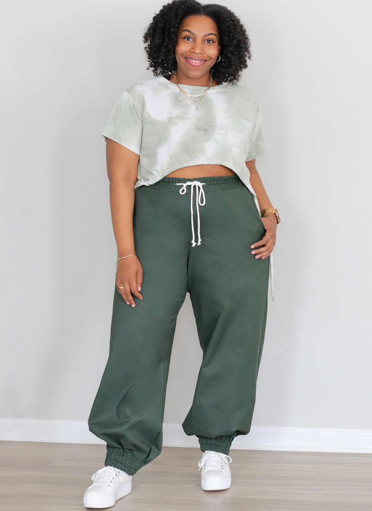 McCall's ME2110 sewing pattern envelope showing women's plus size loose fit t-shirt top designs