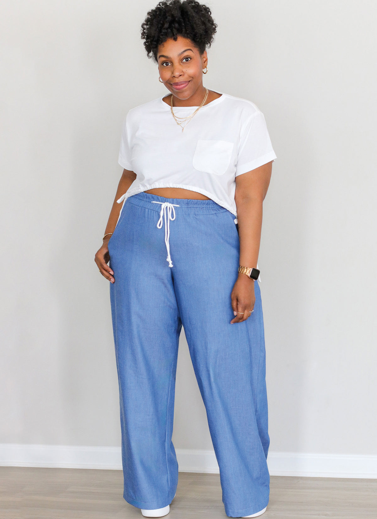 McCall's ME2110 sewing pattern envelope showing women's plus size loose fit t-shirt top designs