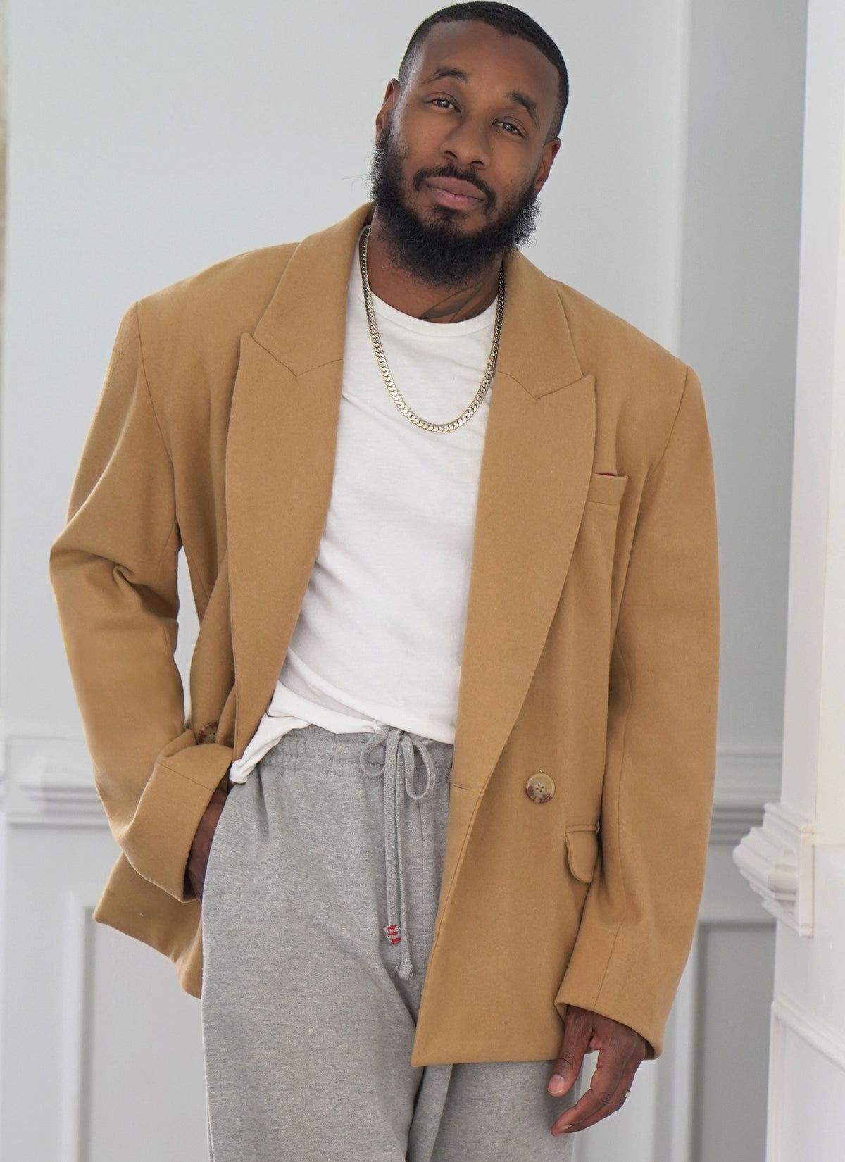McCall's ME2118 sewing pattern envelope showing men's oversized double-breasted jacket designs