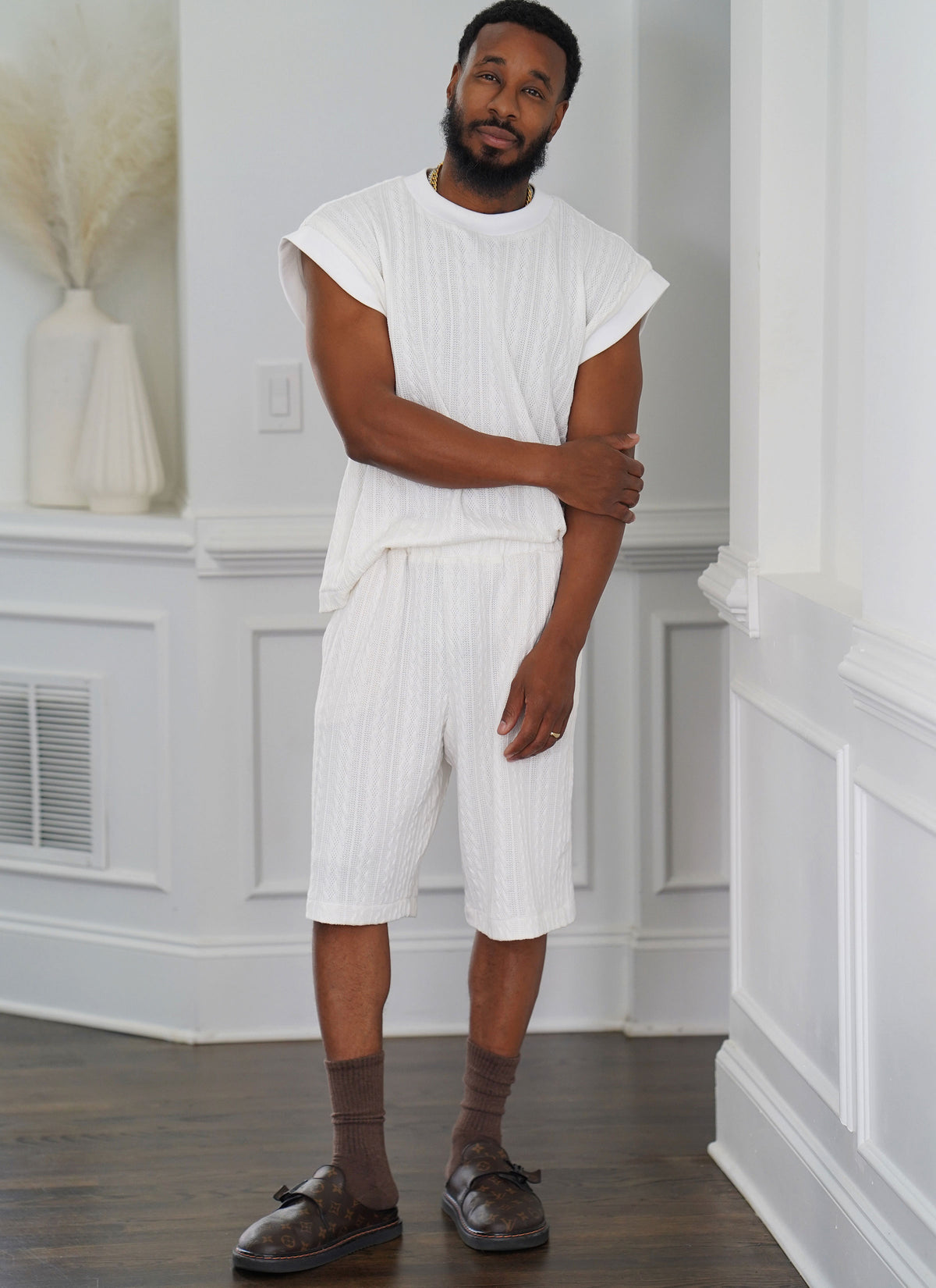McCall's ME2130 sewing pattern envelope showing men's oversized knit top & shorts designs