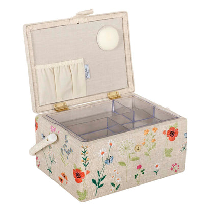 Sewing box covered in embroidered wildflowers with raffia cord handle