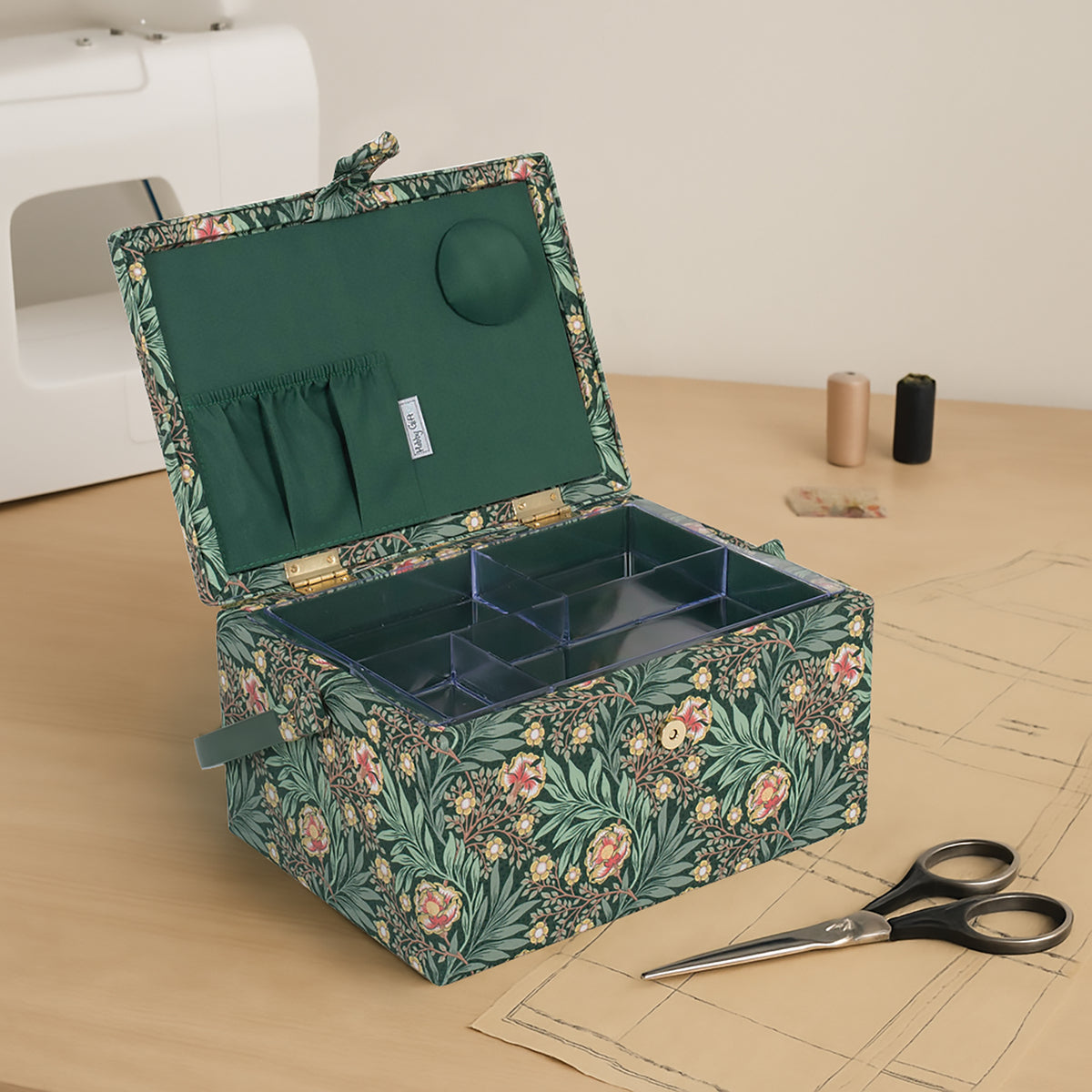 Medium sewing box covered in green arts and crafts floral fabric
