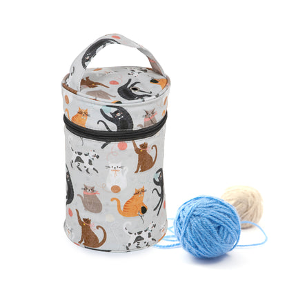 Fabric wool holder with a cat print, carry handle and yarn eyelet on top