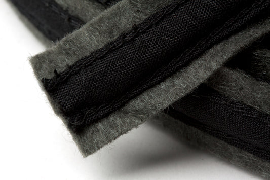 Dark grey felt covered polyester boning