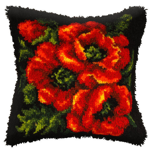 Finished latch hook cushion with red poppies on black design