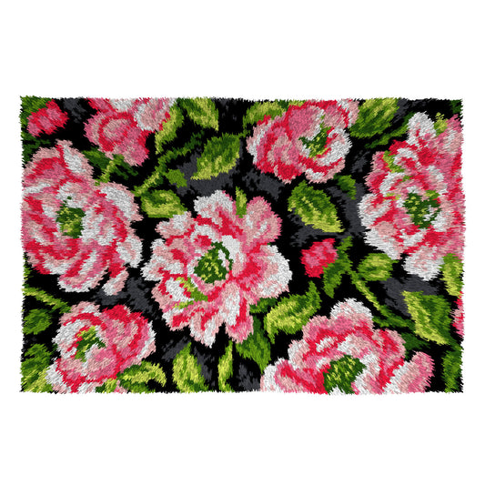 Finished latch hook rug with pink roses on black design