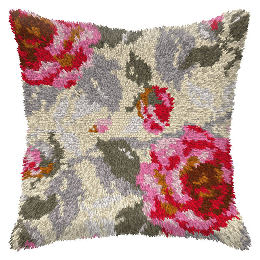 Finished Orchidea latch hook cushion showing pink roses with grey leaves on a cream background