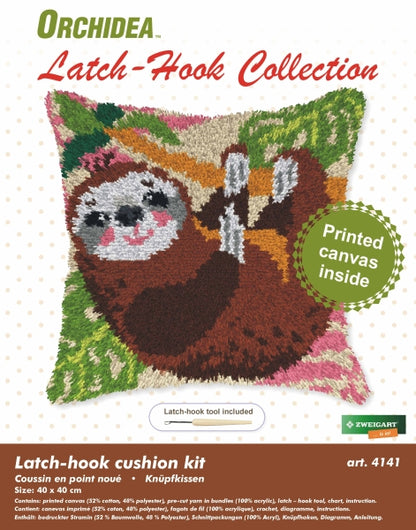 Finished Orchidea latch hook cushion showing a brown sloth hanging from a branch with green leaves