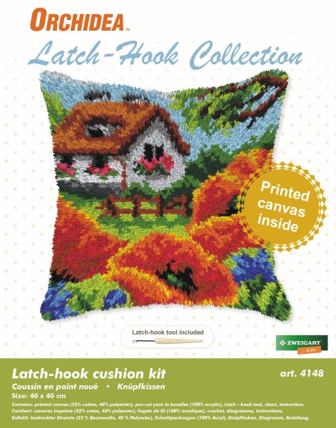 Finished Orchidea latch hook cushion showing a cottage with red poppies