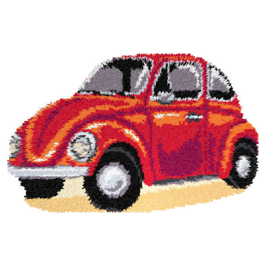 Finished Orchidea latch hook rug showing a red car