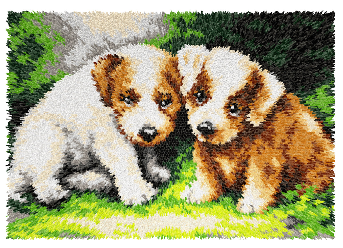 Finished Orchidea latch hook rug showing a group of puppies