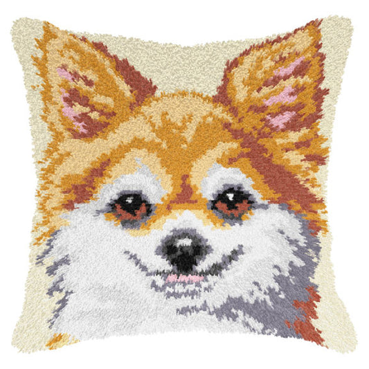 Finished Orchidea latch hook cushion showing a smiling ginger and white dog with pointed ears