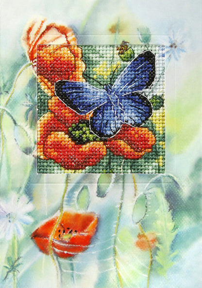 Cross stitch greetings card showing a butterfly with red poppies