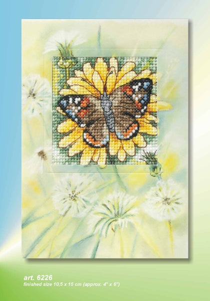 Cross stitch greetings card showing a butterfly on a sunflower