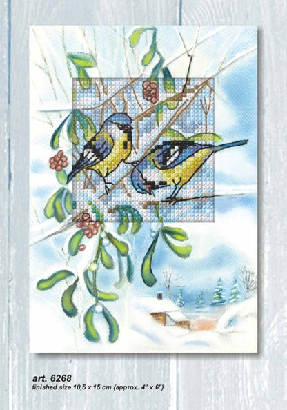 Cross stitch greetings card showing two blue tits on a branch with mistletoe