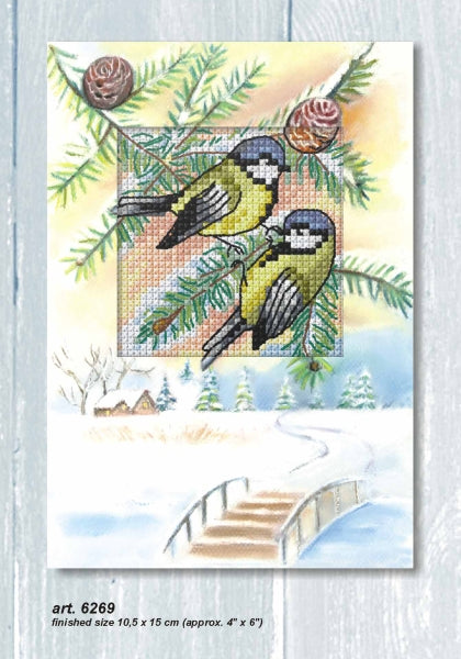 Cross stitch greetings card showing two blue tits on a fir branch