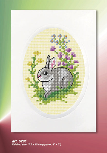 Cross stitch greetings card showing an Easter bunny on yellow fabric