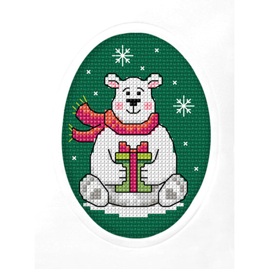 Cross stitch greetings card showing a Christmas bear on green fabric