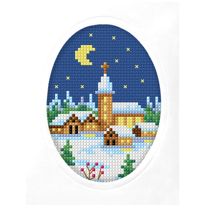 Cross stitch greetings card showing a church on navy fabric