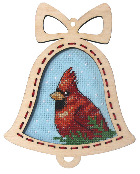 Orchidea cross stitch kit with a cardinal design in an engraved wooden bell-shaped frame