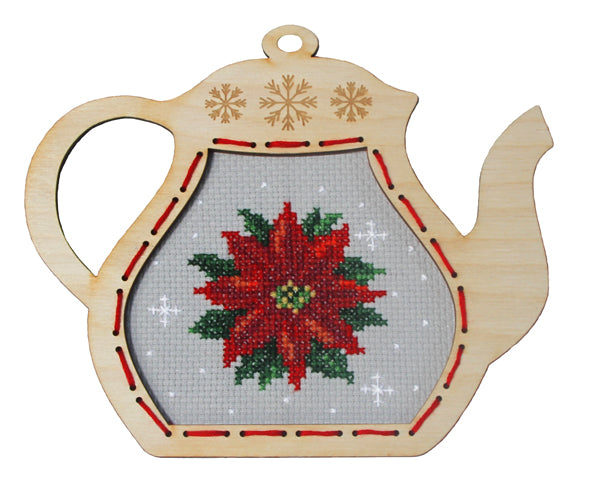Orchidea cross stitch kit with a poinsettia design in an engraved wooden teapot-shaped frame