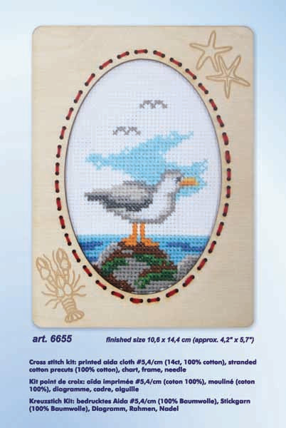 Orchidea cross stitch kit with a seagull design in an engraved wooden frame