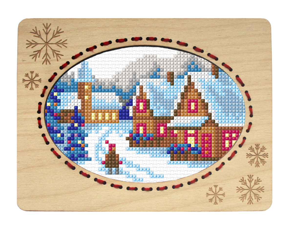 Orchidea winter landscape cross stitch in an engraved plywood frame