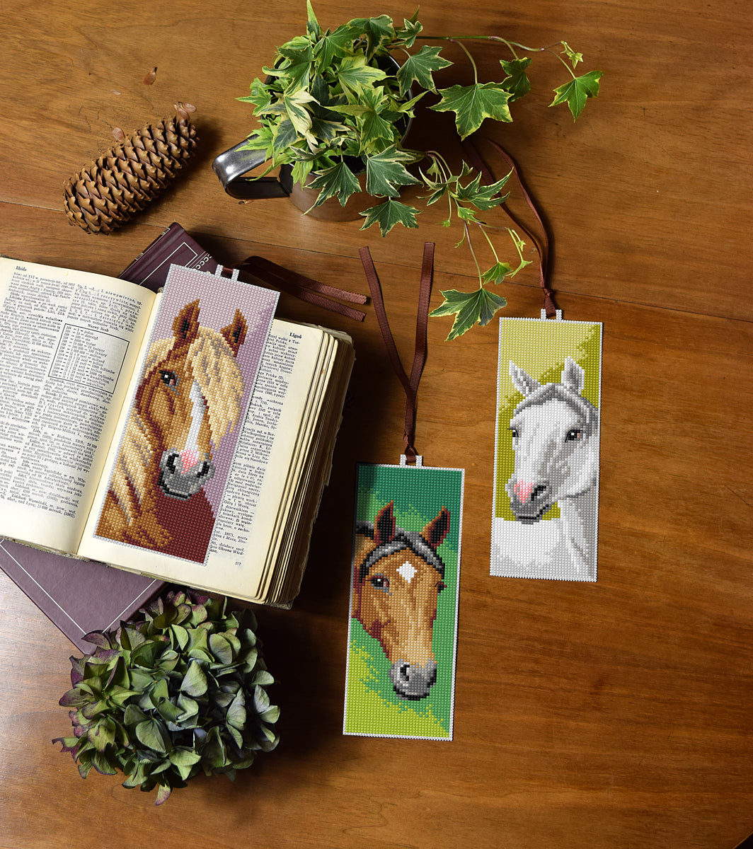 Set of 3 cross stitched horse bookmarks on white plastic canvas
