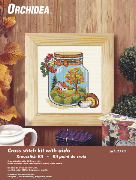 Cross stitch picture of a glass jar with autumn themed contents