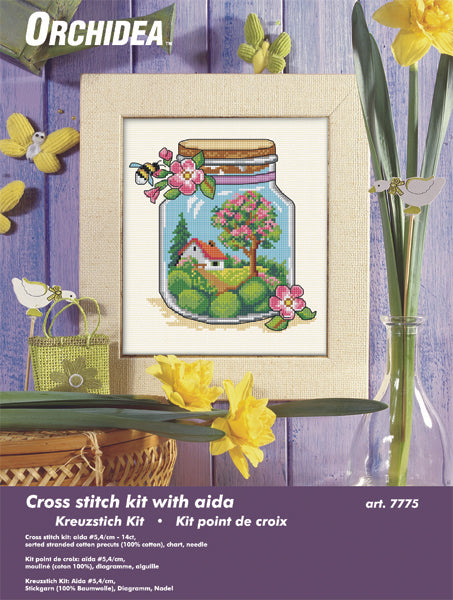 Cross stitch picture of a glass jar with spring themed contents