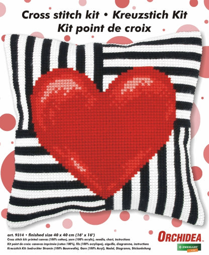 Finished cross stitch cushion with a red heart design