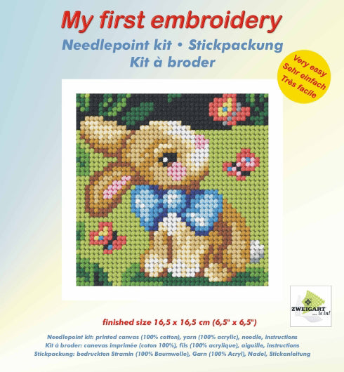 Finished beginner's needlepoint picture showing a springtime