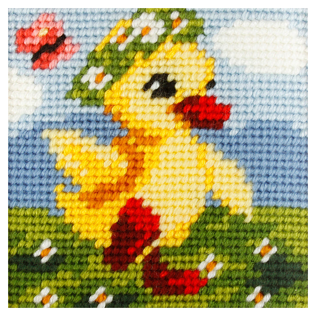 Finished beginner's needlepoint picture showing a chick