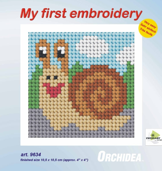 Finished beginner's needlepoint picture showing a snail