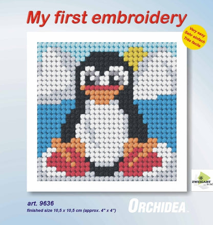 Finished beginner's needlepoint picture showing a penguin