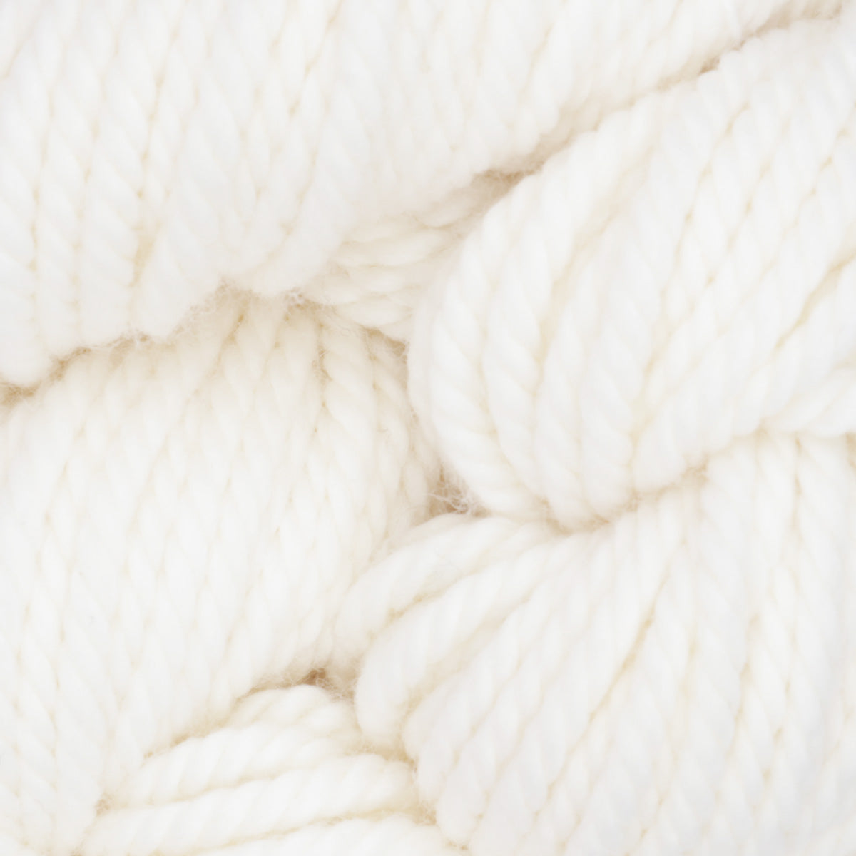 Skein of bleached white hand-dyed wool punch needle yarn