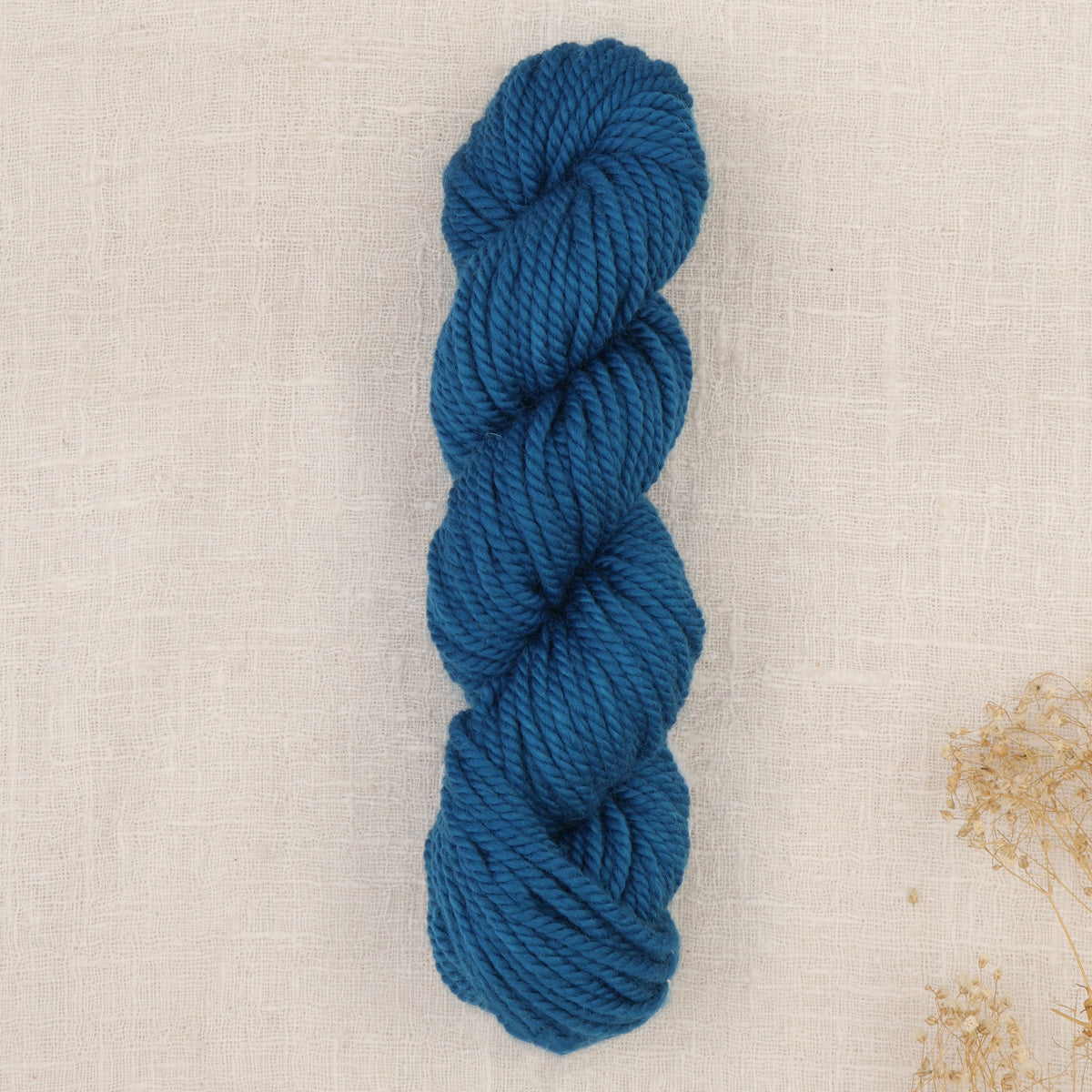 Skein of punch needle rug yarn in Island Blue